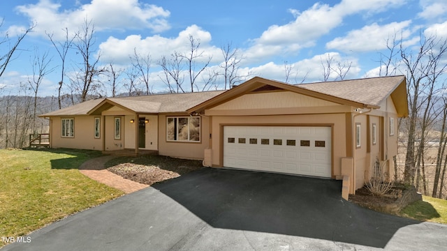 ranch-style home with an attached garage, a shingled roof, driveway, stucco siding, and a front lawn