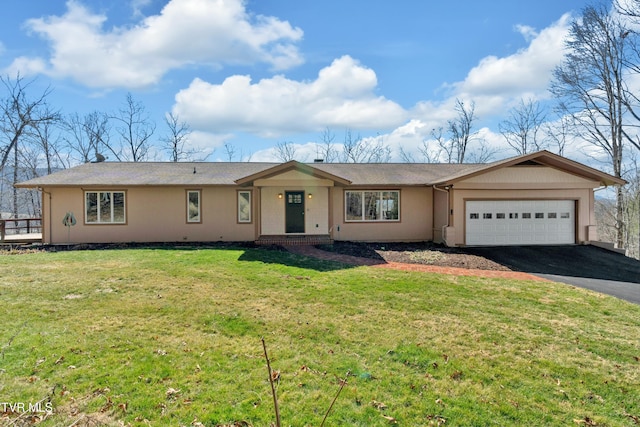 single story home featuring a front yard, driveway, and an attached garage