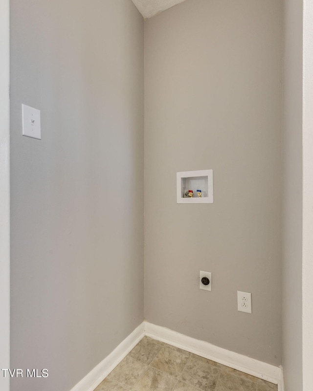 washroom with baseboards, laundry area, hookup for a washing machine, and hookup for an electric dryer