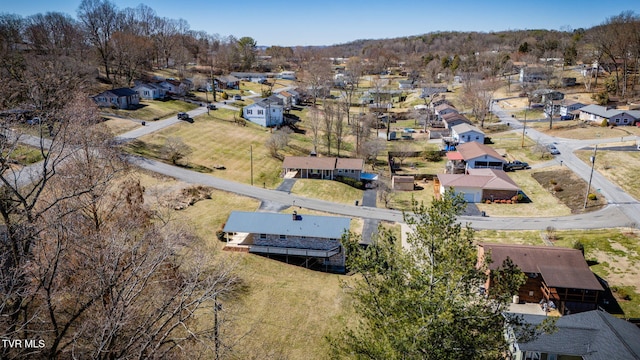 birds eye view of property with a residential view