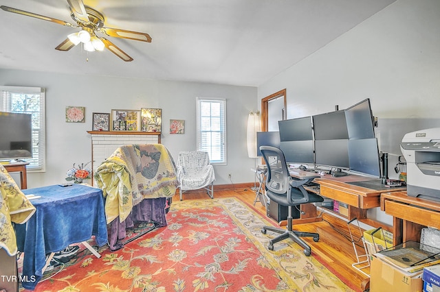 office area featuring wood finished floors, a ceiling fan, and baseboards