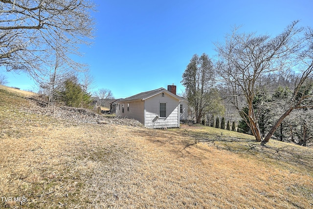 view of side of property featuring a chimney