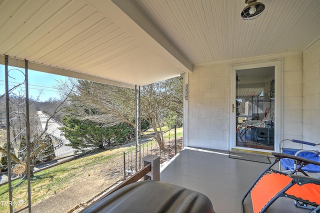 sunroom with beamed ceiling