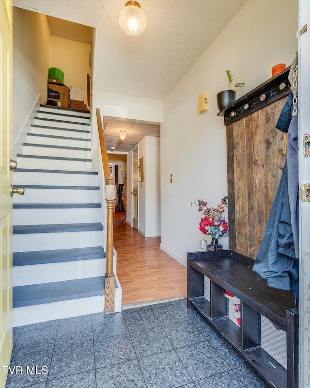 mudroom featuring baseboards