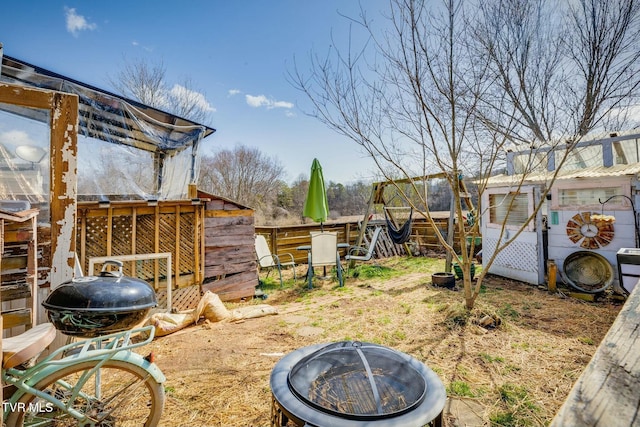 view of yard with an outdoor structure and fence