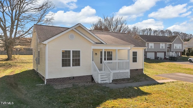 view of front of house with crawl space, roof with shingles, a porch, and a front yard