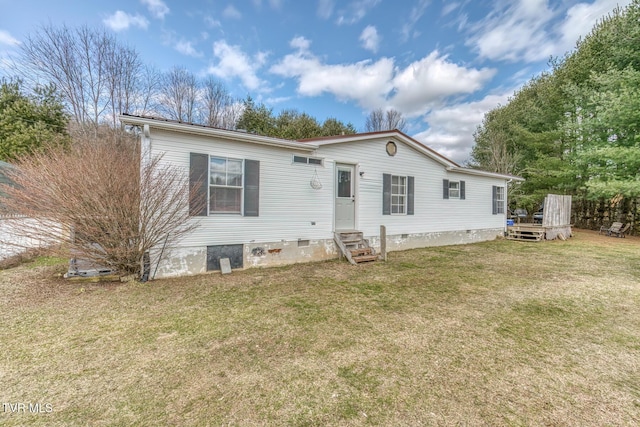 view of front of property with entry steps, crawl space, and a front lawn