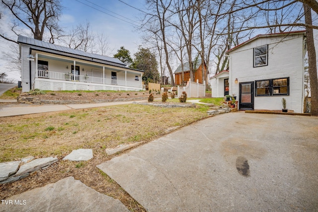 view of yard with covered porch