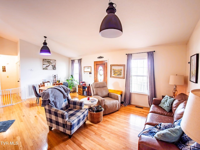 5659 Browning Way, Russellville, TN 37860 - living area featuring light wood-style floors, lofted ceiling, and visible vents