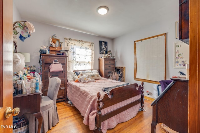 bedroom featuring wood finished floors