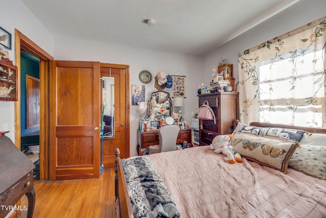 bedroom with light wood-type flooring