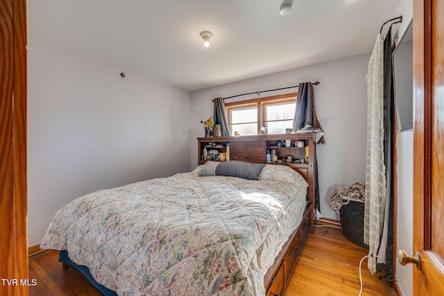 bedroom featuring wood finished floors