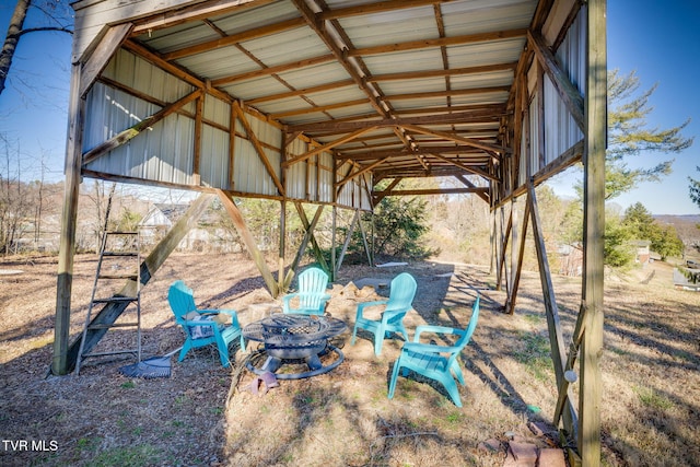 view of yard featuring an outdoor fire pit