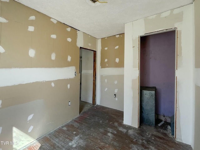 spare room with a textured ceiling