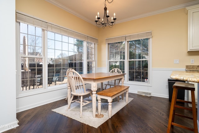 dining space featuring an inviting chandelier, visible vents, dark wood finished floors, and crown molding