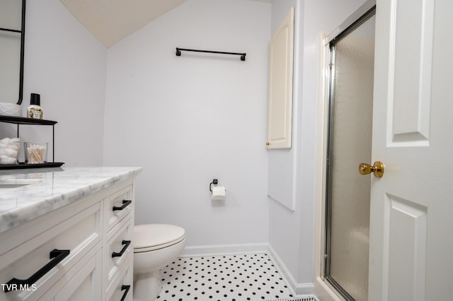 bathroom featuring baseboards, a shower stall, toilet, and vanity