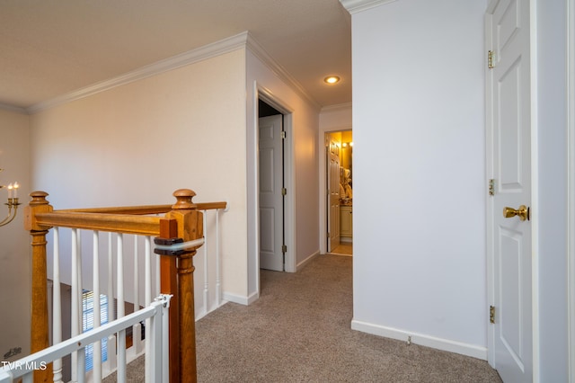 corridor featuring recessed lighting, ornamental molding, carpet flooring, an upstairs landing, and baseboards