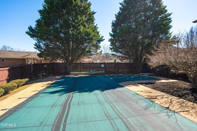 view of swimming pool with fence