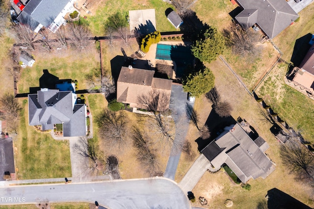 birds eye view of property with a residential view