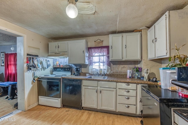 kitchen with black dishwasher, electric range oven, light wood-style flooring, under cabinet range hood, and a sink