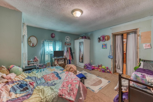 carpeted bedroom featuring a textured ceiling