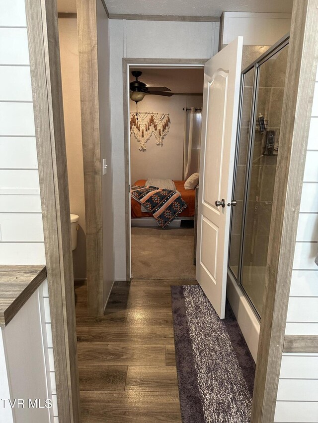 hallway with wood finished floors