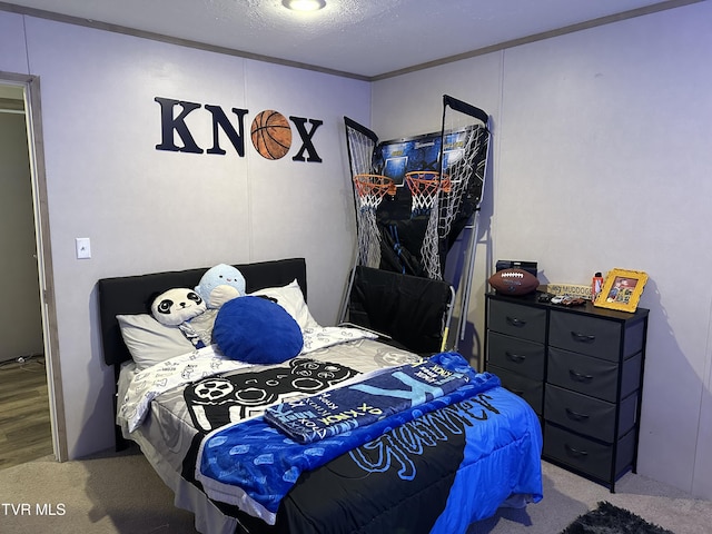 carpeted bedroom with a textured ceiling