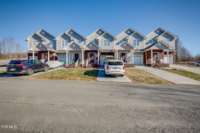 multi unit property featuring concrete driveway