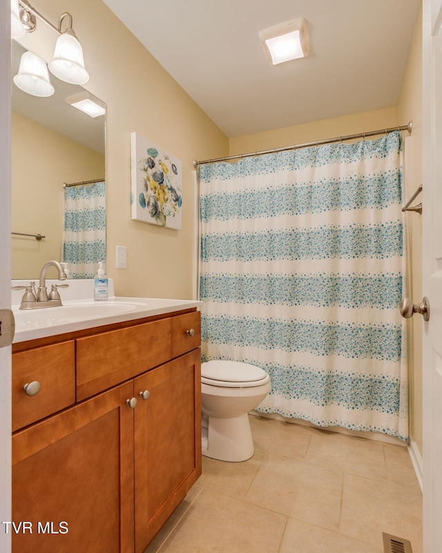 full bath with curtained shower, visible vents, toilet, vanity, and tile patterned flooring