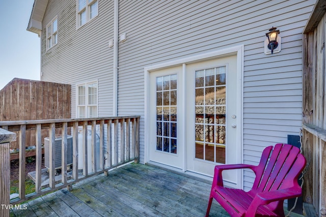 view of wooden balcony featuring a wooden deck and central air condition unit