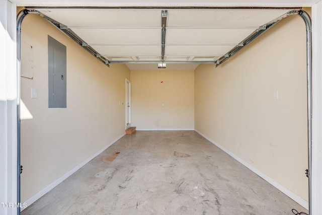 garage with electric panel and baseboards