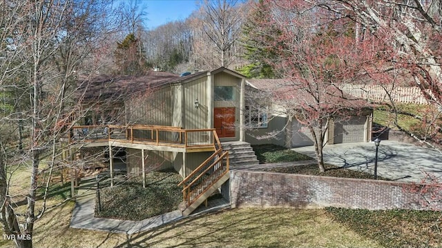 exterior space featuring stairway and concrete driveway