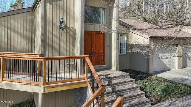 exterior space featuring concrete driveway and an attached garage