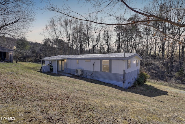 manufactured / mobile home featuring crawl space and a lawn