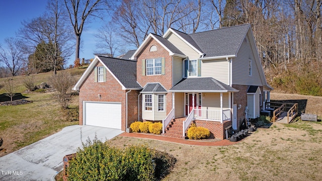 traditional home with brick siding, a front yard, roof with shingles, covered porch, and driveway