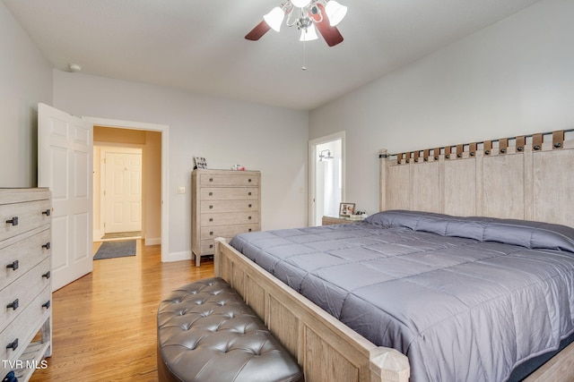 bedroom with baseboards, light wood-style floors, and a ceiling fan