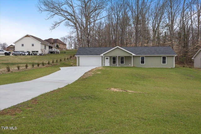 single story home featuring a garage, driveway, and a front lawn