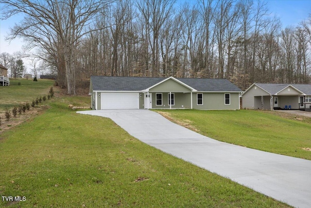 ranch-style home with a garage, concrete driveway, and a front yard