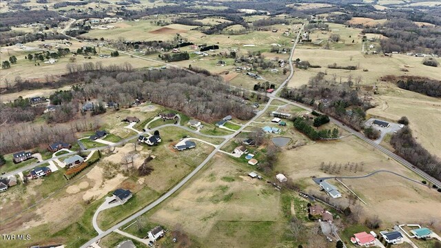 birds eye view of property featuring a rural view