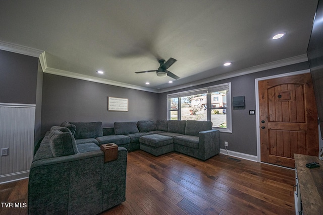 living area with dark wood-type flooring, recessed lighting, wainscoting, and ornamental molding