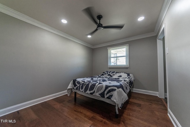 bedroom featuring baseboards, recessed lighting, wood finished floors, and crown molding