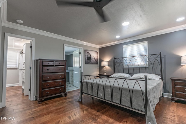 bedroom with crown molding, multiple windows, and dark wood-type flooring