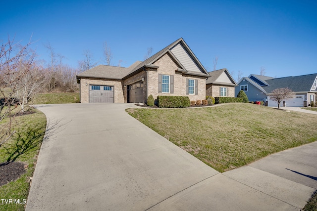 view of front of home featuring a garage, driveway, a front lawn, and brick siding