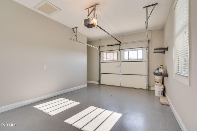 garage with a garage door opener and baseboards