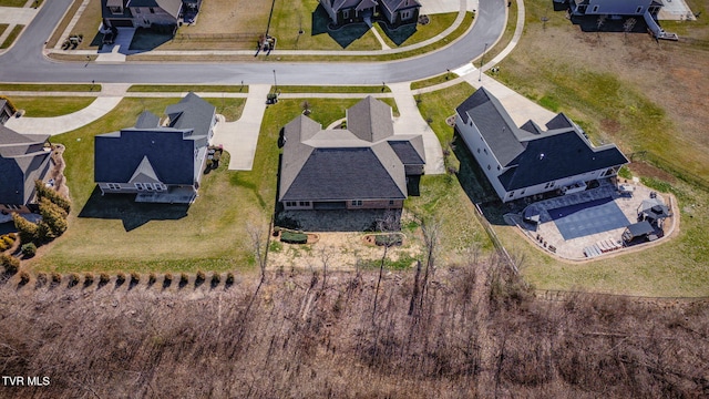 birds eye view of property with a residential view