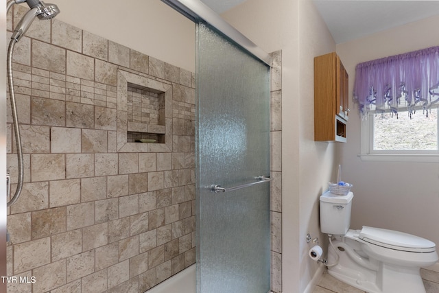 full bathroom with toilet and a shower with shower door