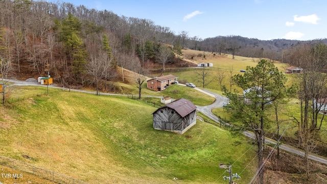 exterior space with a wooded view