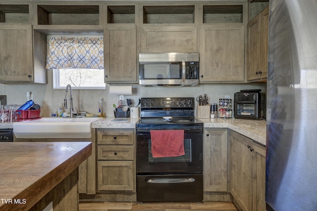 kitchen featuring stainless steel appliances and a sink