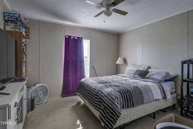 bedroom with carpet floors, ceiling fan, ornamental molding, and a textured ceiling