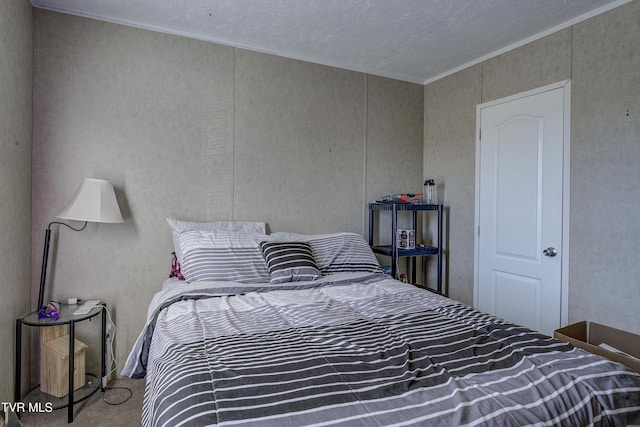 bedroom featuring carpet floors and crown molding